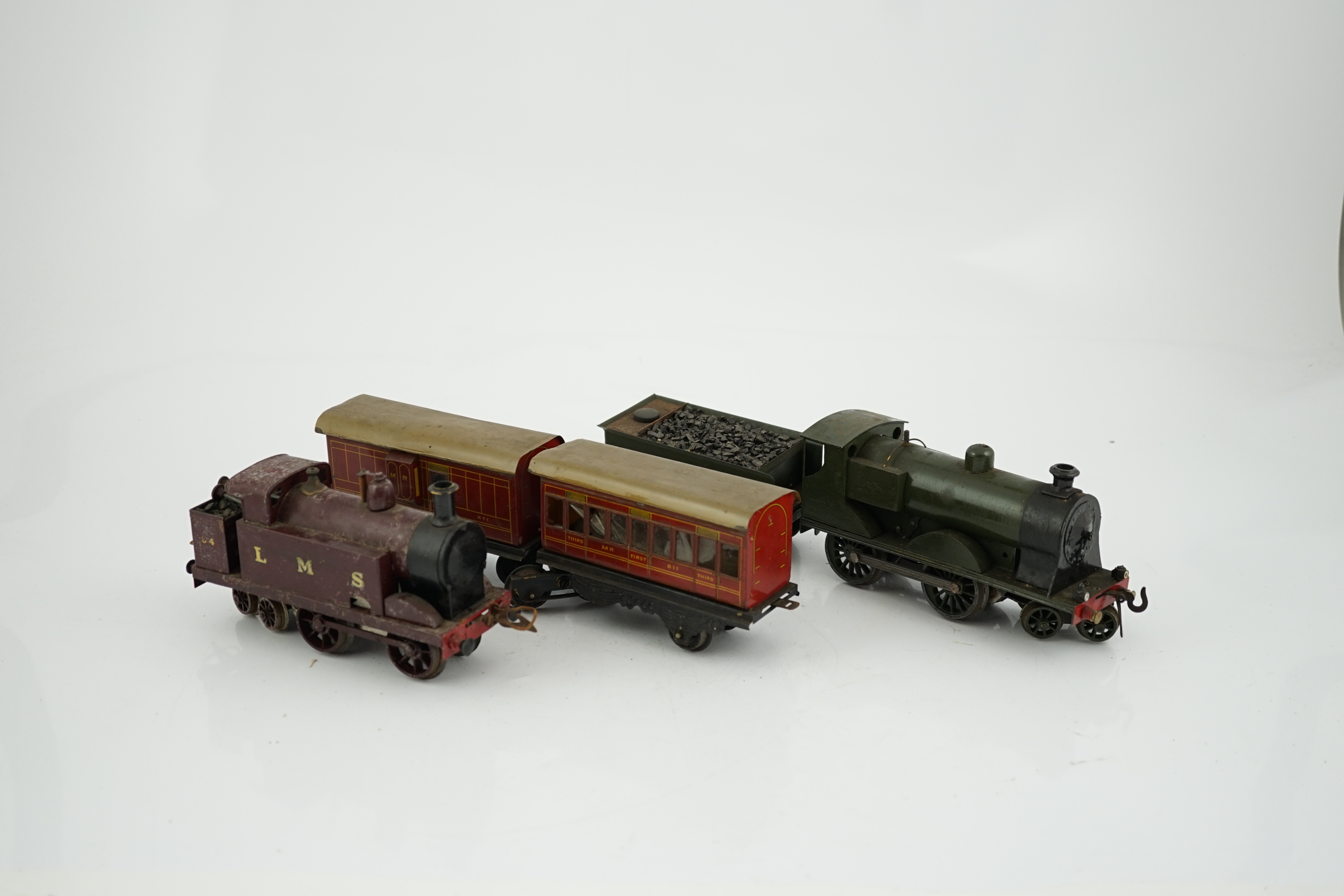 Ten 0 gauge tinplate railway items, most adapted from other parts and models, including three clockwork locomotives; n LSWR 4-4-0 tender loco, an LMS 0-4-4T loco and an SR 0-4-2T loco, together with four SR 4-wheel coach